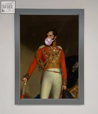A bubble gum admiral framed wall art of a man in red and gold military uniform blowing a pink bubblegum bubble