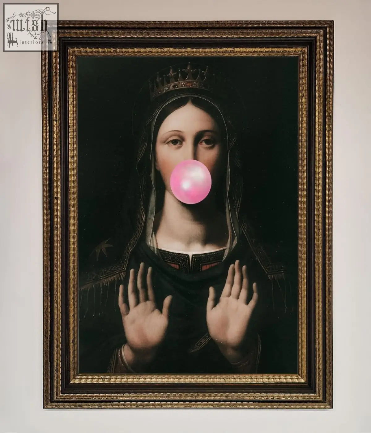 A framed bubble gum renaissance print featuring a crowned figure in dark attire blowing a bright pink bubblegum bubble