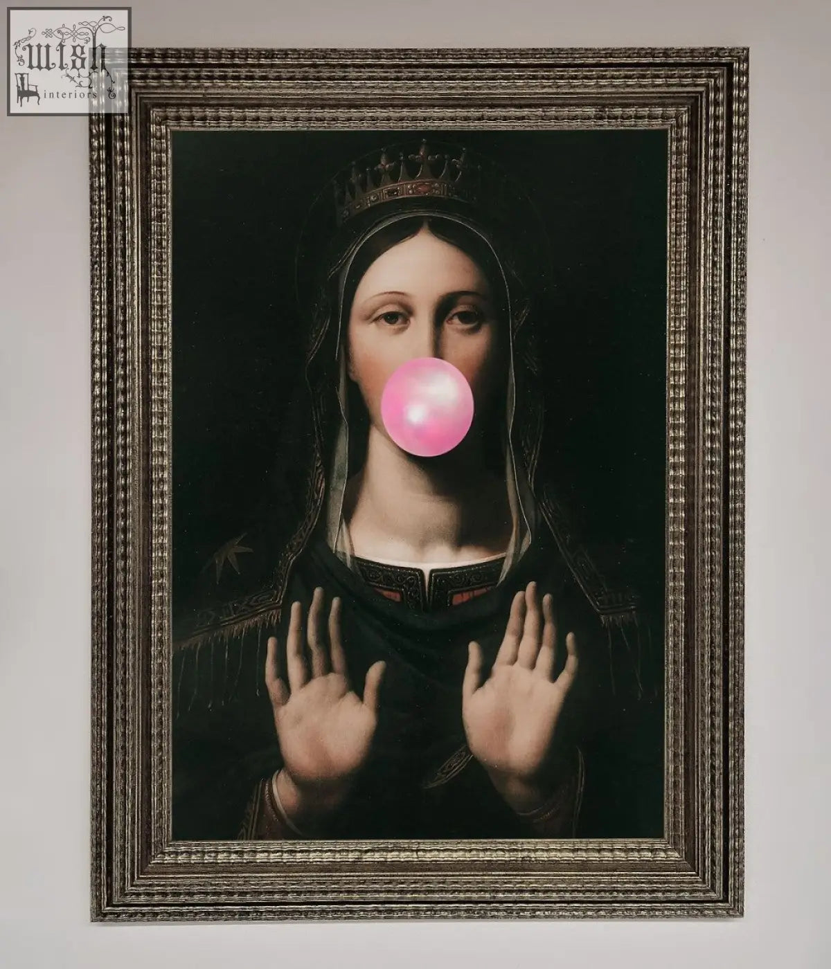 A framed print of a dark classical portrait with a crowned figure blowing a bright pink bubble gum bubble bubble gum renaissance