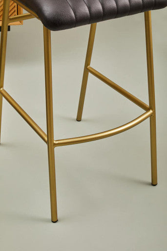 Gold finished metal bar stool with buffalo black leather quilted seat perfect as a leather bar chair
