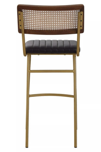A buffalo black leather bar chair with a dark brown woven cane back black leather seat and gold metal frame