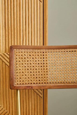 Rectangular cane panel with woven natural fiber framed by dark wood on the back of buffalo black leather bar chair