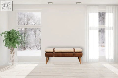 Brown buffalo hide leather bench with cream cushion and wooden legs perfect for stylish seating