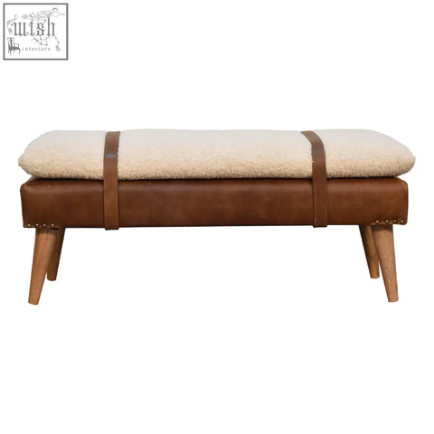 Brown leather buffalo hide leather bench with cream sheepskin upholstery and wooden legs for cozy seating