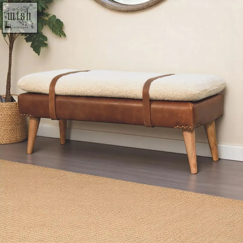 Brown leather buffalo hide leather bench with cream sheepskin cushion and wooden legs for stylish seating