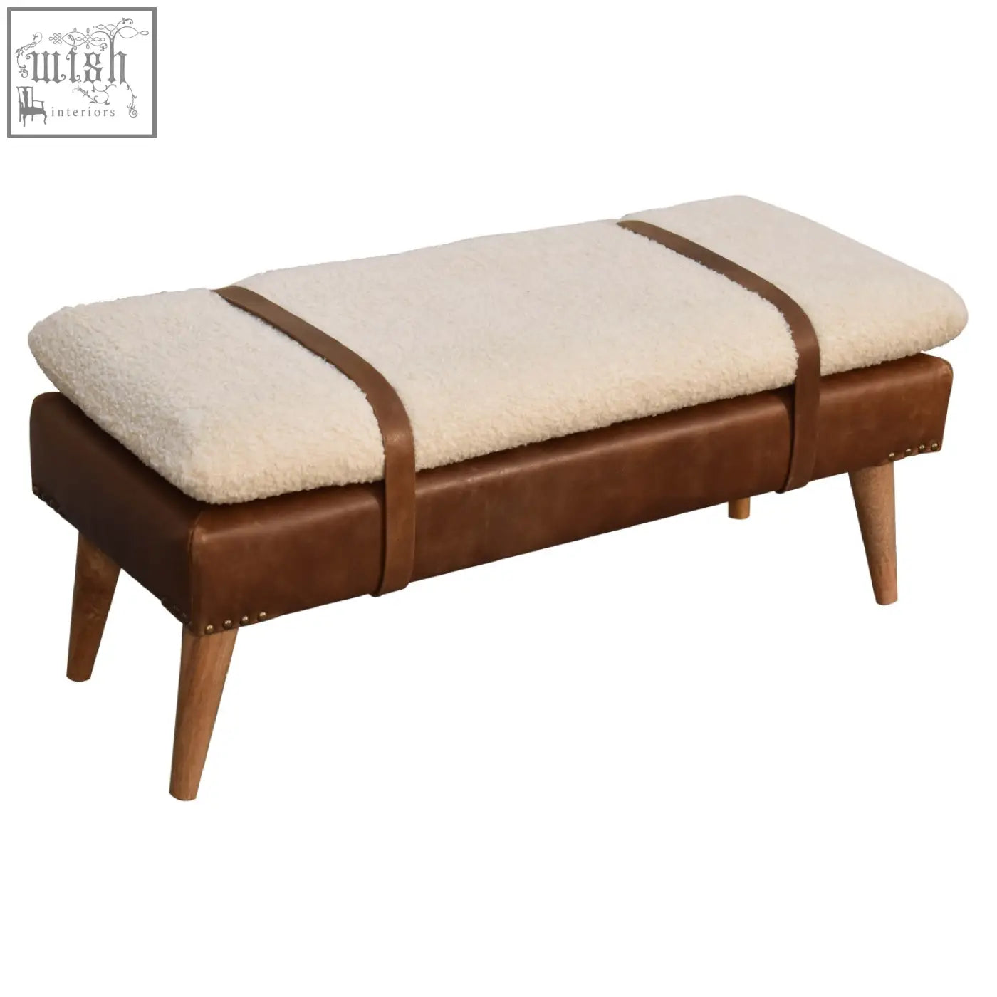 Cream-colored sheepskin cushioned bench with buffalo hide leather brown straps and wooden legs for stylish seating