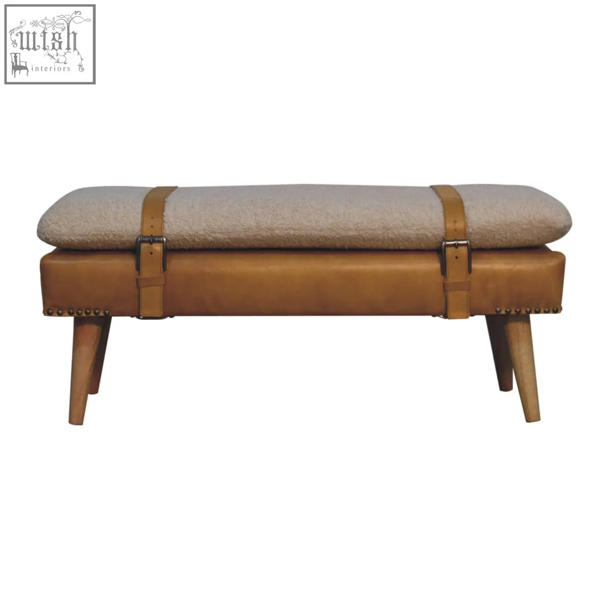 Tan leather bench with beige textured cushion and wooden legs inspired by buffalo hide olive green style