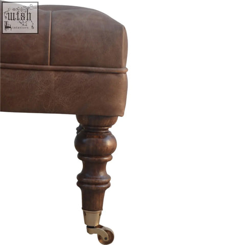 Brown buffalo leather storage bench with tufted rectangular form and turned wooden legs for additional seating