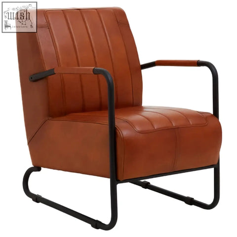 Buffalo tan leather armchair with tan leather upholstery and black metal frame featuring curved legs