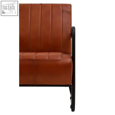 Buffalo tan leather armchair in tan leather with black metal frame for a stylish and modern seating option