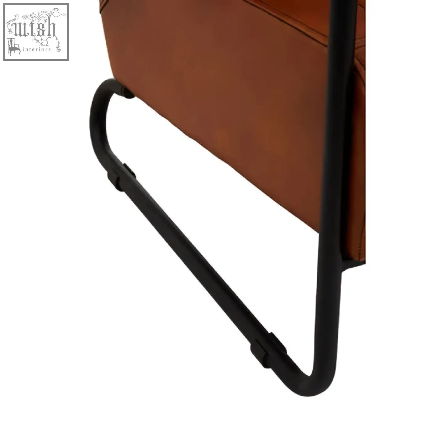 Brown leather side table with sleek black metal frame complements buffalo tan leather armchair in tan leather style