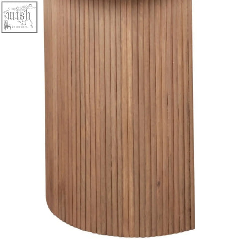 A cylindrical wooden side table with vertical slats in warm mango wood finish from bundi natural marble collection