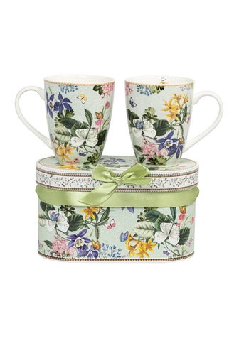 A pair of porcelain butterfly garden mugs with mint green base and floral patterns in a gift box set