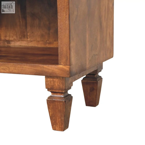 A rustic brown wooden cadiz carved shoe bench with tapered legs and visible wood grain finish