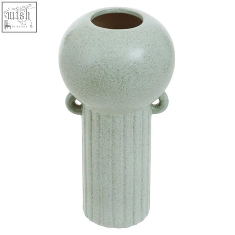 A matte light green ceramic calcita large speckled vase with rounded top ribbed sides and two loop handles