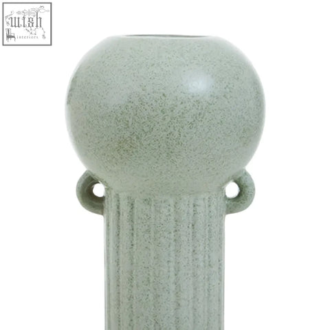 A calcita large speckled green ceramic vase with a sleek rounded top and vertical ridged columns