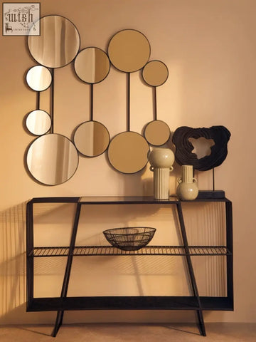 Modern geometric mirror wall art with circular mirrors complements the calcita small speckled green vase decor