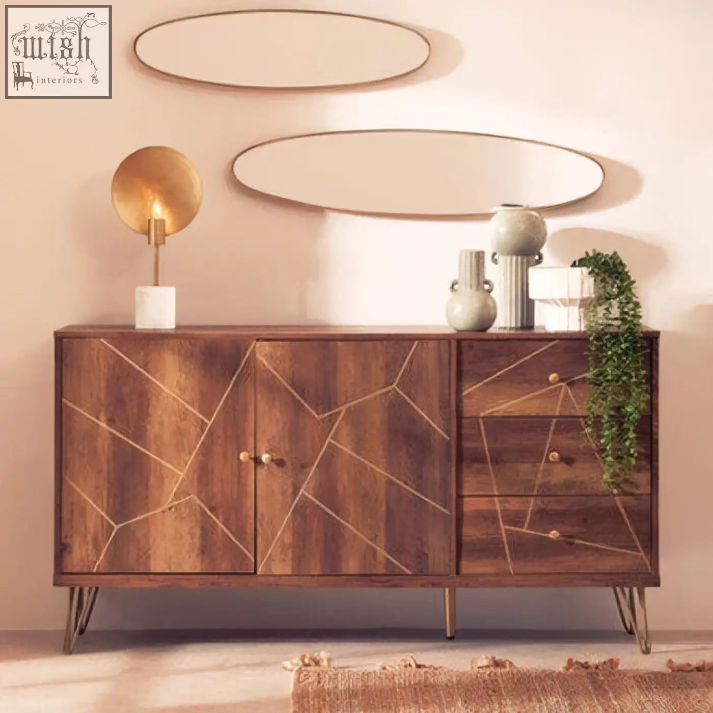 Wooden sideboard with geometric gold inlay and slender metal legs beside a calcita small speckled green vase