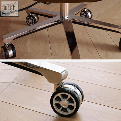 Chrome-finished caster wheel with black rubber tire on calder swivel office chair with leathaire seat for smooth mobility