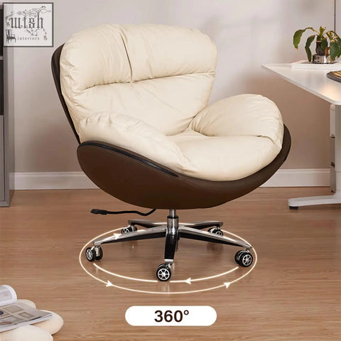 Cream-colored plush cushioned calder swivel office chair with brown leather frame and chrome base with wheels
