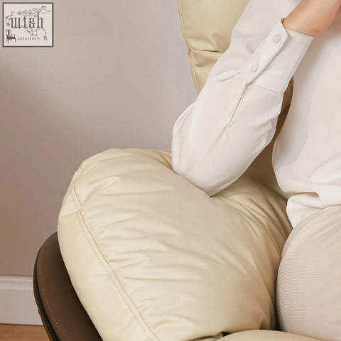 Cream-colored calder swivel office chair with padded cushioned leathaire seat and backrest on wheels