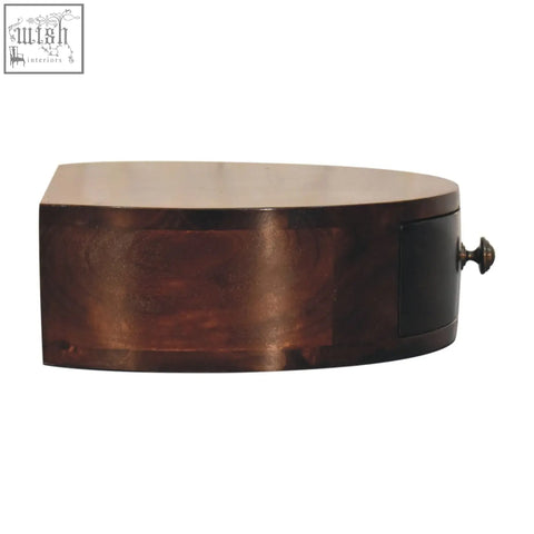 Dark brown california walnut wall mounted bedside table with smooth surface and ornate brass handle drawer