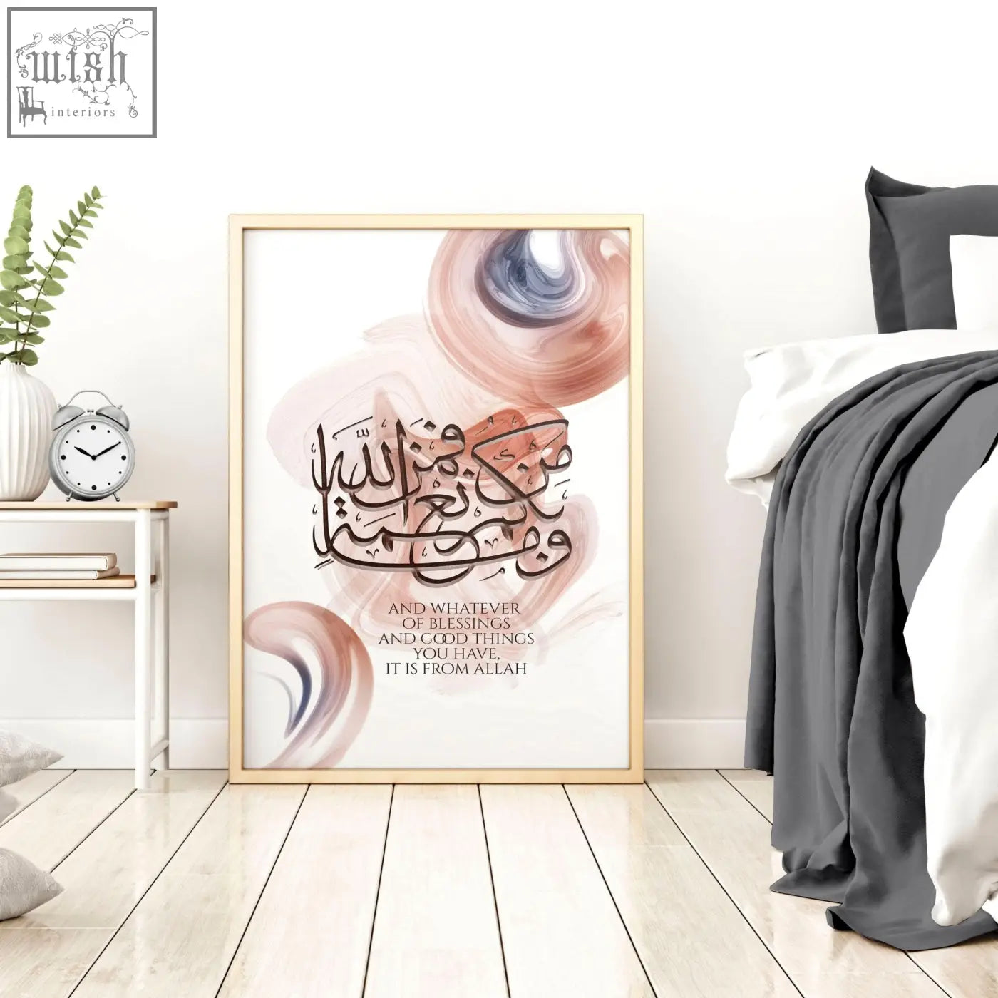 A framed calligraphy arabic art wall print with elegant black script and soft peach and muted blue swirls on white background