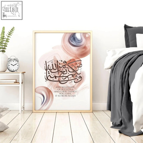 A framed calligraphy arabic art wall print with elegant black script and soft peach and muted blue swirls on white background