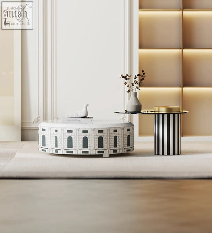 White ceramic nesting coffee table set designed like a roman coliseum with black architectural detailing