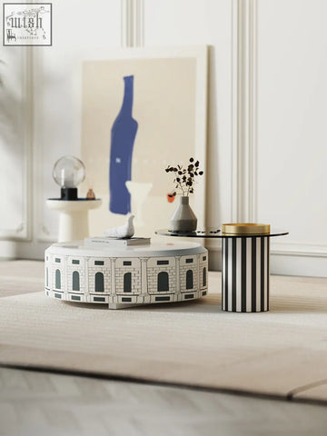 White nesting coffee table with architectural amphitheater design and black arched windows in calloway set