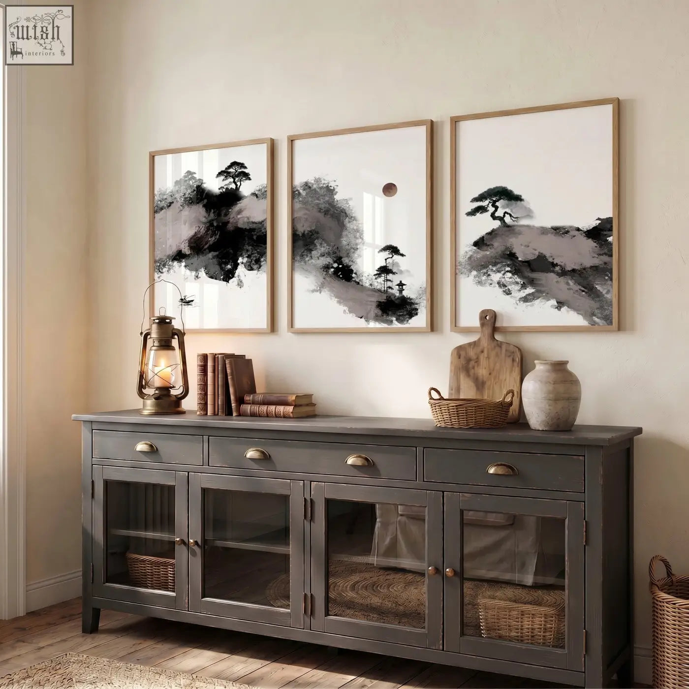 Dark gray wooden sideboard with glass-paneled doors and brass handles complements calming wall art set of 3