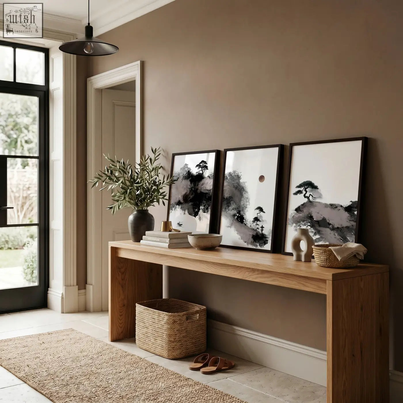 Minimalist wooden console table with natural finish and open storage beneath paired with calming wall art set of 3
