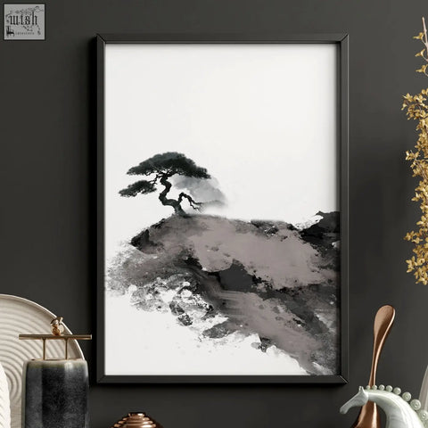 Black-framed calming wall art featuring minimalist ink wash pine tree on rocky terrain with maroon sun and fisherman