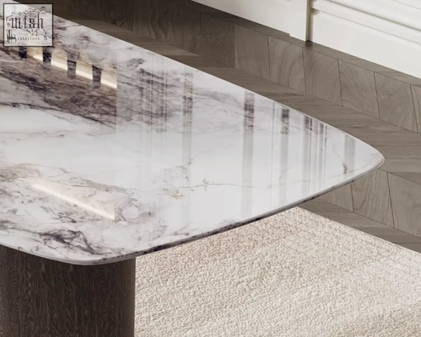A sleek cameron marble dining table with a triangular white marble top and dark wood base perfect as a marble dining table