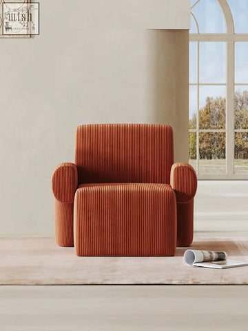 Cozy orange corduroy camilla armchair with plush ribbed texture and rounded arms available with shipping cost and offer financing