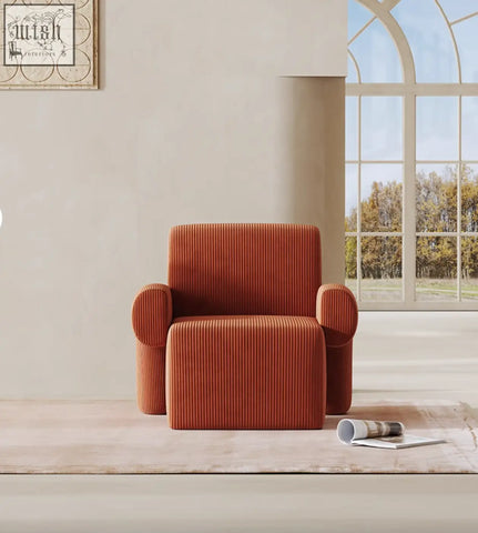 A cozy orange camilla armchair with deep seat and plush ribbed corduroy fabric perfect for relaxing with low shipping cost