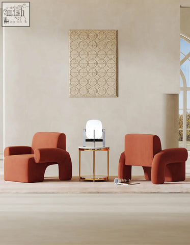 Modern orange upholstered camilla armchair with deep seat and sculpted ergonomic form perfect for comfort and style