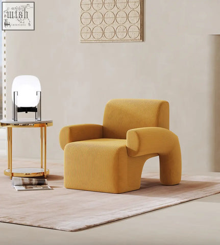 A mustard-yellow corduroy camilla armchair with modern sculpted design offering financing and low shipping cost options