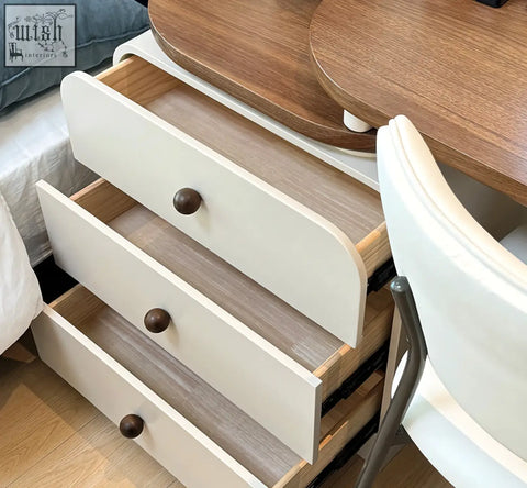 White wooden dressing table dresser with three drawers featuring dark brown knobs and light wood interior