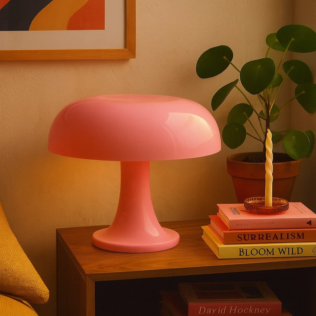 A sleek matte pink mushroom-shaped table lamp with a smooth dome and slender stem called candy ambient mushroom lamp