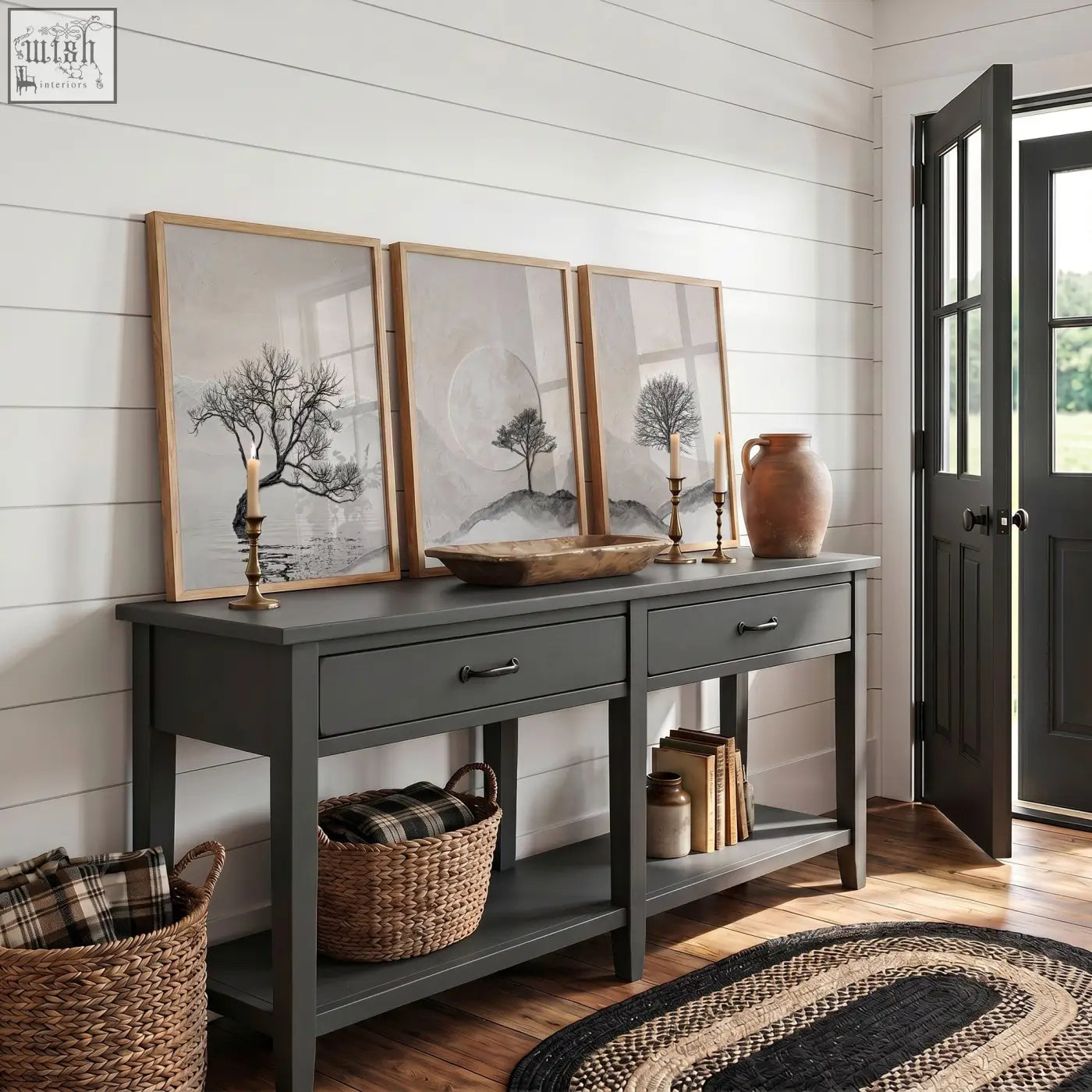 Dark gray wooden console table with two drawers and open shelving paired with canvas art landscape prints set of 3