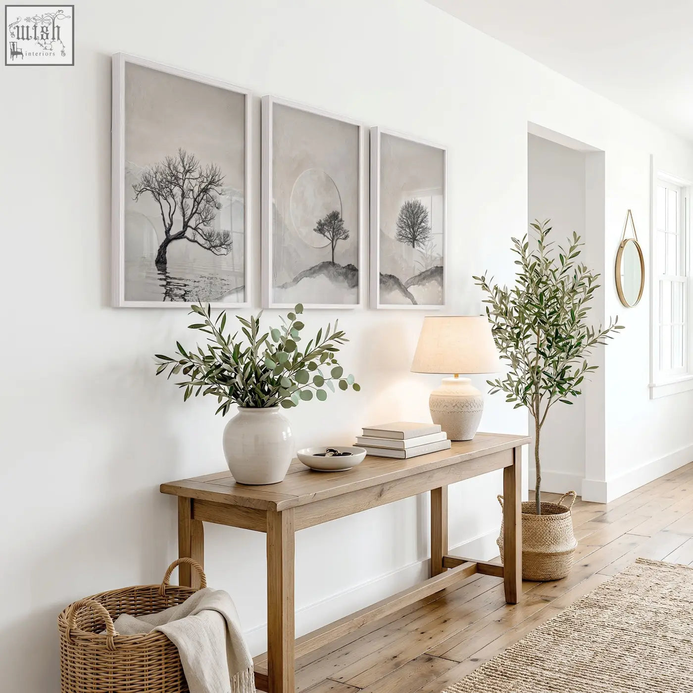 Minimalist wooden console table with natural finish and sturdy legs below canvas art landscape scandi nordic trees and moon prints set of 3