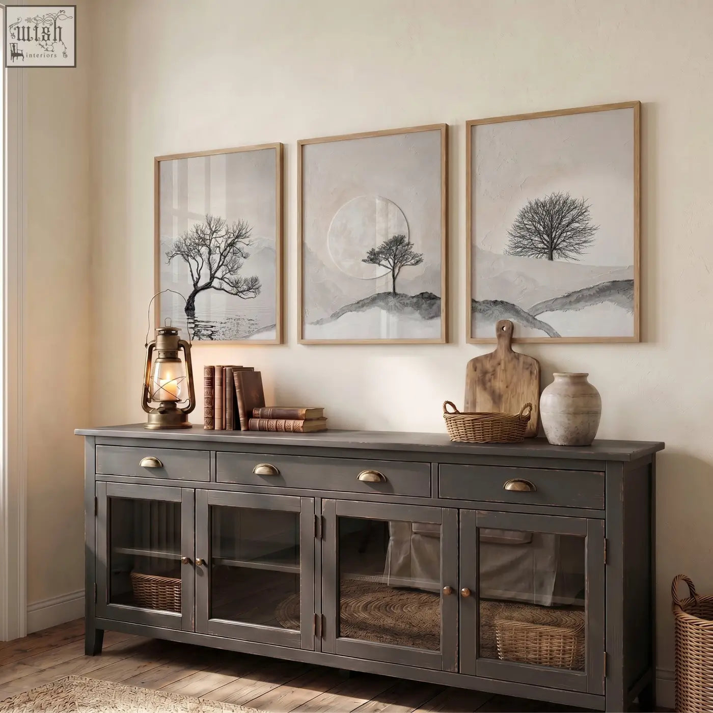 Dark gray rustic sideboard with glass paneled doors and brass handles below canvas art landscape scandi nordic trees and moon wall art prints set of 3