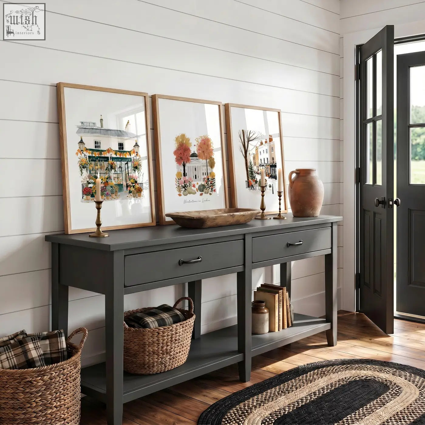Dark gray painted console table with drawers and rustic bowl centerpiece beneath covent garden london travel wall art prints