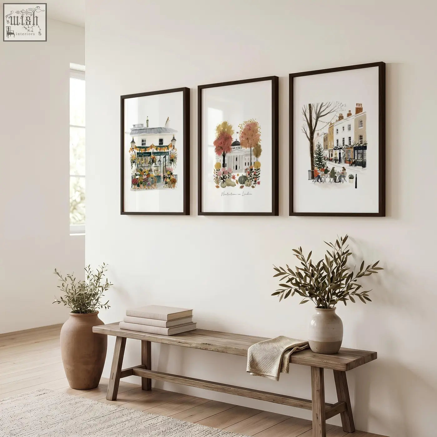 Three framed watercolor prints of covent garden london travel scenes hang as travel wall art on a white hallway wall