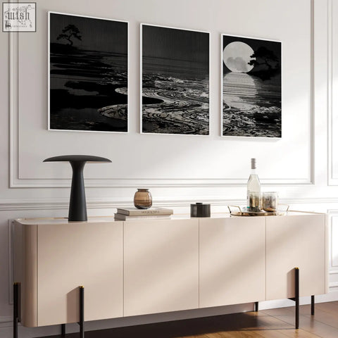 Cream-colored sideboard with minimalist design and slender black legs beside deep charcoal living room canvas pictures set of 3