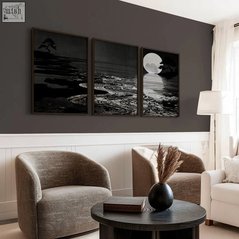 Black ceramic vase with dried pampas grass next to deep charcoal canvas pictures for living room japandi style
