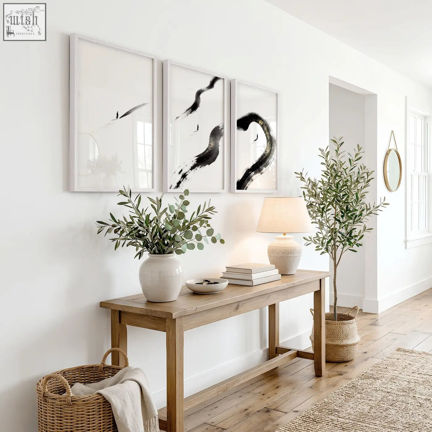 A minimalist wooden console table with natural finish featuring canvas zen wall art black ink brushstroke prints