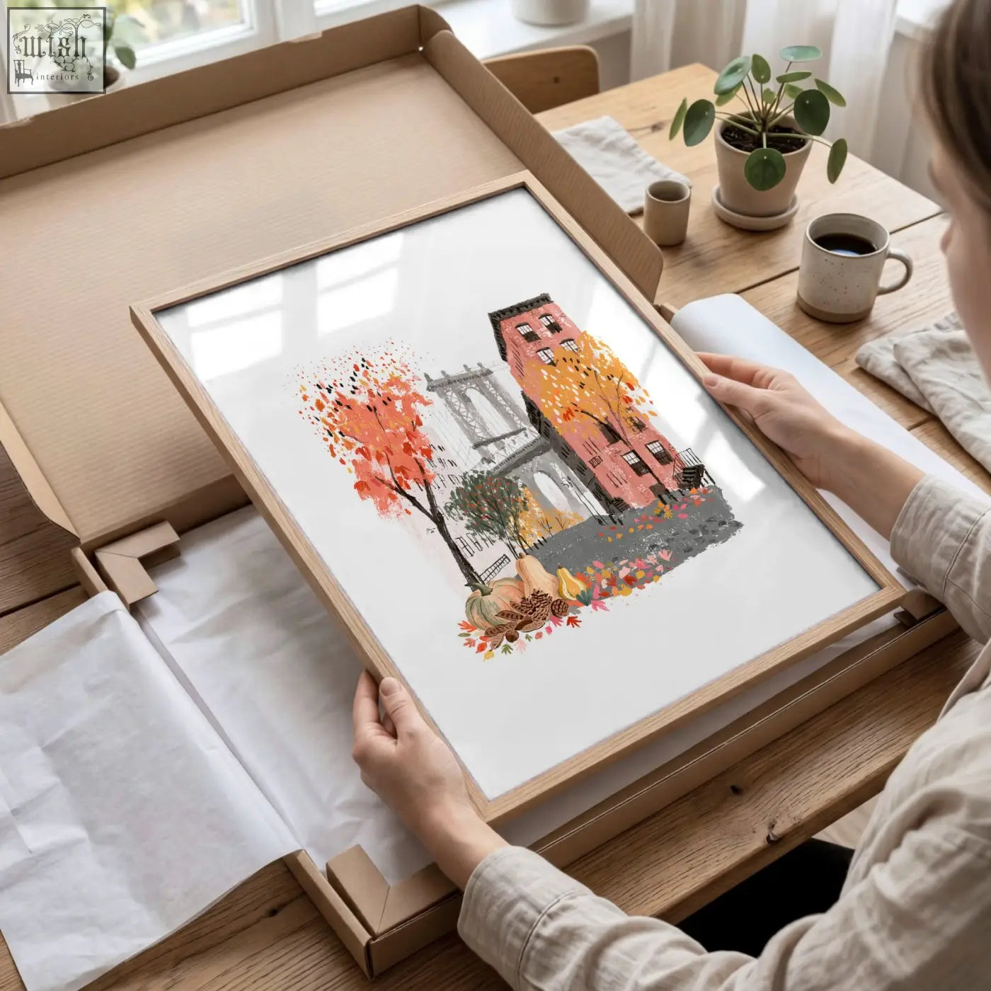 A framed autumn nyc brick building illustration with pumpkins in a light wood frame perfect for living room wall art prints
