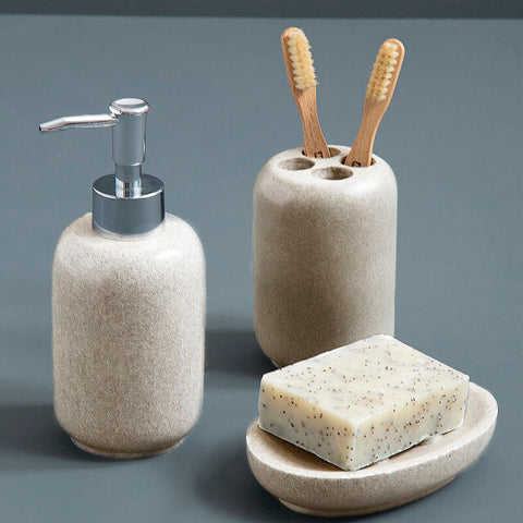 Beige textured ceramic stone effect lotion dispenser with sleek chrome pump for natural stone effect look
